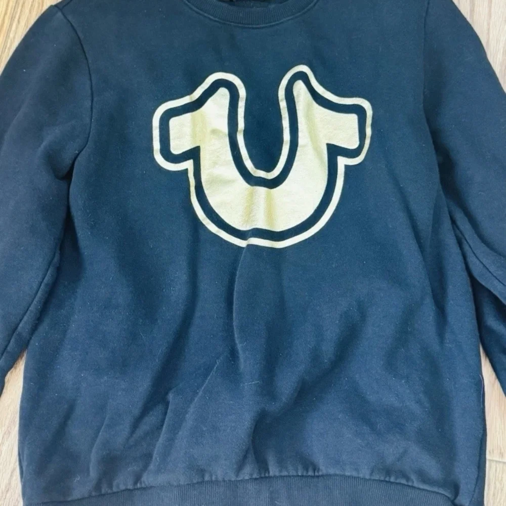 Black Sweater with Gold Logo